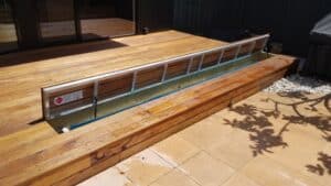 Wooden Deck with Pool Cover System — Pool Cover Systems in Nowra, NSW