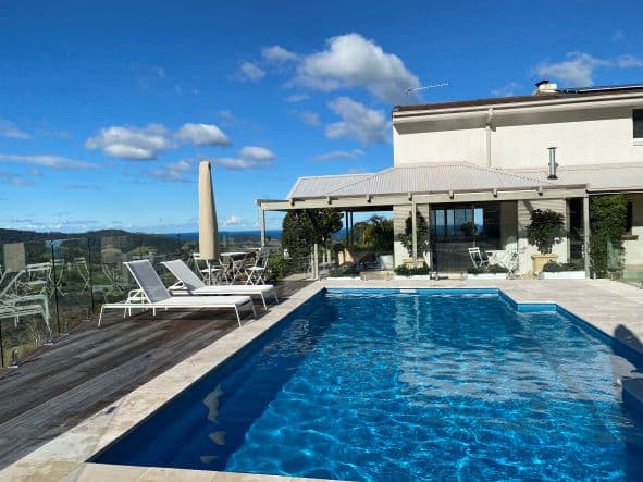 Pool with Blue Sky View — Pool Cover Systems in Nowra, NSW