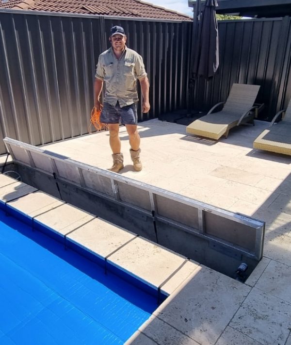 A Man Worker And Swimming Pool — Pool Cover Systems in Nowra, NSW